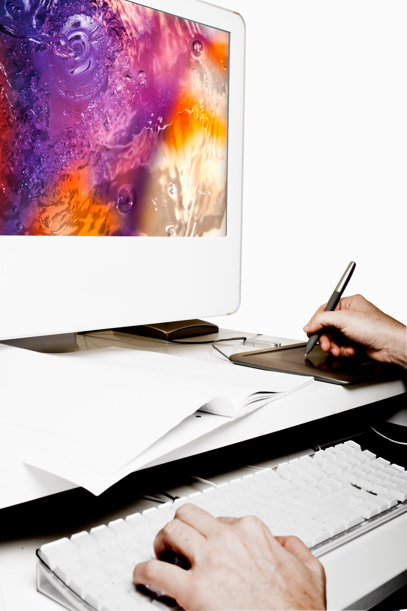 desk with paper computer and keyboard